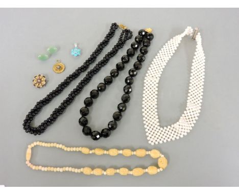 A cultured freshwater pearl 'V' shaped necklace, a silver turquoise cluster pendant, probably reconstituted, a rolled gold sp