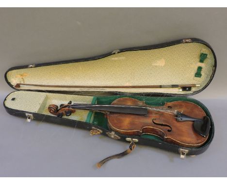 A German full size violin, circa 1890, with two piece back and bow, in case, bow stamped 'Czechoslovakia', back measures 14in