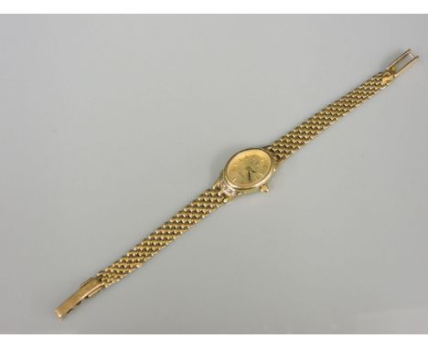 A ladies 9ct gold Vicence diamond set quartz bracelet watch, with an oval champagne dial, raised gilt batons and gilt and bla