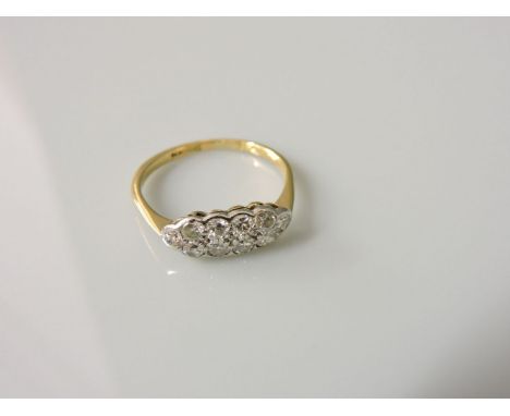An Edwardian two row diamond boat shaped cluster ring, marked 18ct plat