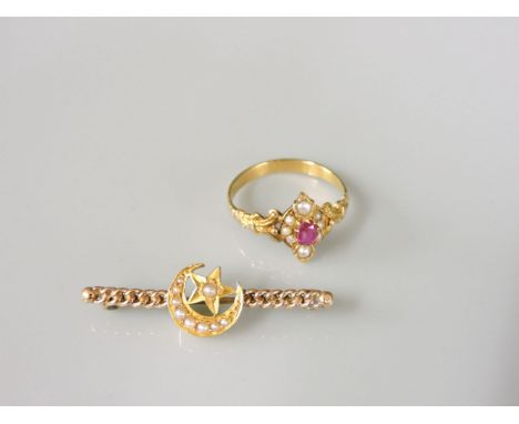 A ruby and split pearl marquise shaped cluster ring, tested as approximately 18ct gold, and a late Victorian gold crescent br