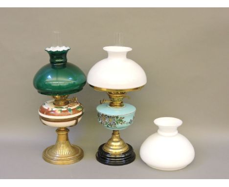 A Victorian brass oil lamp, with decorative painted ceramic fount, and fitted with a Hink's No 2 Duplex burner, 58cm high, a 