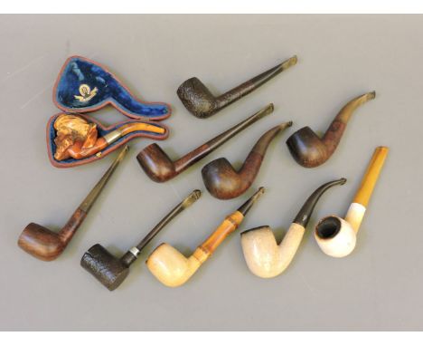 A Meerschaum pipe, modelled as a Turk's head, cased, and other pipes