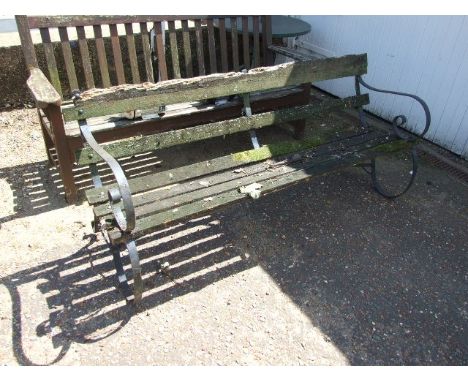 Garden Bench with Wrought Iron Ends 70 inches wide ( wood needs attention )