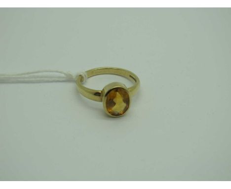 A Modern 9ct Gold Citrine Single Stone Ring, oval collet set (finger size O) (2.9grams). [2025234]