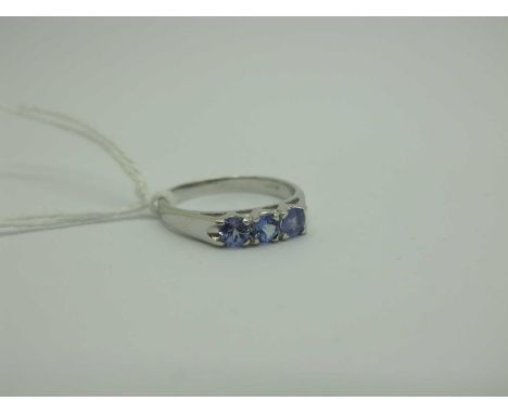 A Modern 9ct White Gold Tanzanite Three Stone Dress Ring, (finger size N) (2.2grams). [2010399]