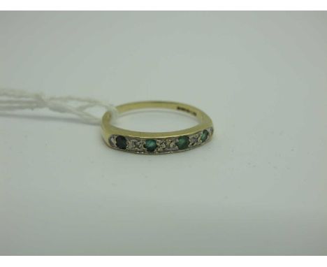 A 9ct Gold Emerald and Diamond Half Eternity Style Ring, alternately illusion set (finger size P1/2). [2025563]