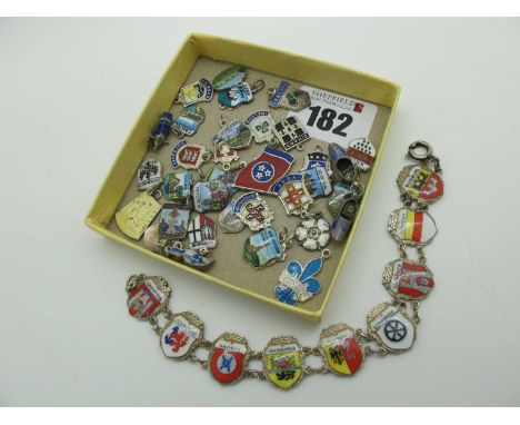 A Souvenir Enamel Panel Style Bracelet, stamped "800" "REU", together with numerous souvenir enamel loose charms, including B