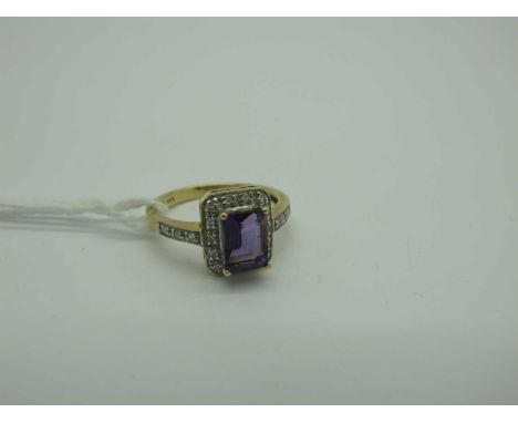 A Modern Amethyst and Diamond Rectangular Cluster Ring, four claw set to the centre, within illusion set border and inset sho