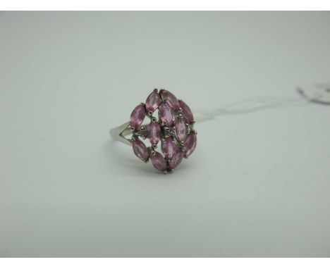 A Modern 9ct White Gold Pink Sapphire Cluster Dress Ring, marquise claw set, between bifurcated shoulders (finger size O). [2