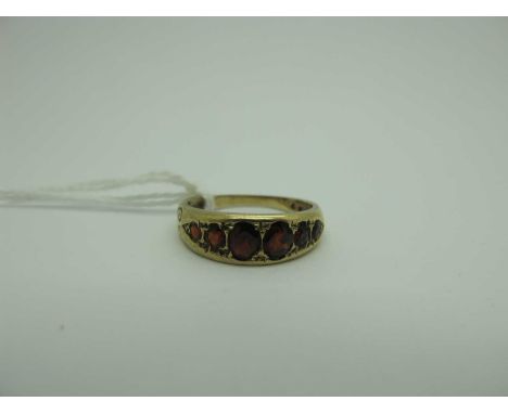 A 9ct Gold Six Stone Garnet Ring, of antique style, graduated set (finger size P) (2.8grams). [2010409]