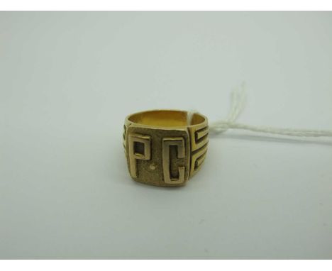 A Small Size Signet Style Ring, initialled in relief "P.C", between textured tapering shoulders, stamped "14K" (approximate f