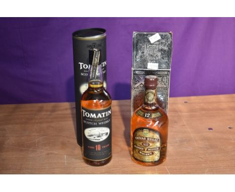 A bottle of Chivas Regal 12 Year Old Blended Scotch Whisky 75cl 43%GL, label on reverse Tax Free Shop Bangkok Airport, in car