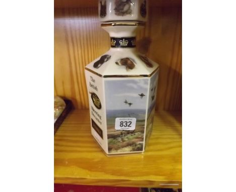 A CERAMIC HEXAGONAL WHISKY CONTAINER THE BRITISH SHOOTING DECANTER WHISKY BY POINTERS OF LONDON (NO CONTENTS)