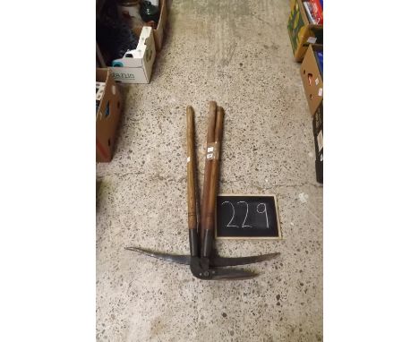 A PICK AXE &amp; A WOOD HANDLED EDGE CUTTER