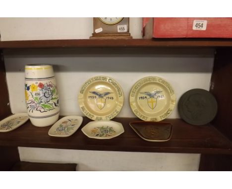 A SHELF OF POOLE POTTERY