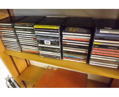 SHELF OF VARIOUS CD'S