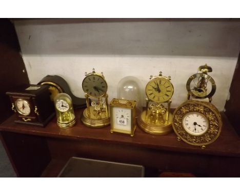 SHELF OF EIGHT VARIOUS BATTERY OPERATED CLOCKS