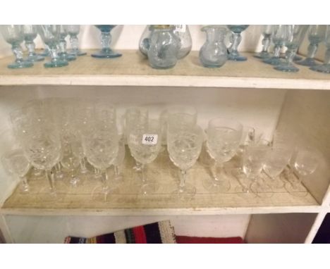 SHELF OF VARIOUS GLASSES