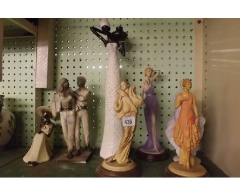 A SHELF OF MODERN FIGURINES
