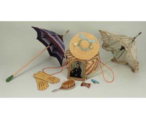 Dolls accessories to include Parasols, leather gloves and bonnet, the two silk parasols with wooden handles, (cream parasol i