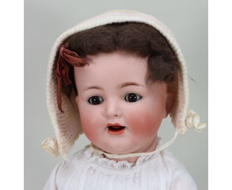 A Simon &amp; Halbig/K&amp;R 126 bisque head baby doll, German circa 1915, with weighted brown glass ‘flirty’ eyes, open mout