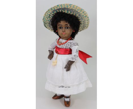 A rare black A.T Kestner bisque head Bebe doll, German circa 1885, with fixed brown glass paper-weight eyes, finely painted l
