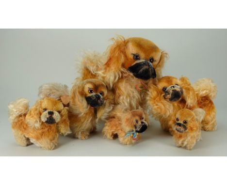 Family of six post-war Steiff ‘Peky’ Pekinese toy dogs, each with brown eyes, short mohair heads and stitched noses, long moh