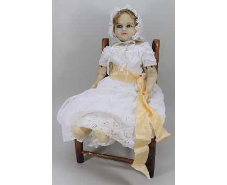 Lucinda Boyd a large poured wax shoulder head doll, probably Meech, English circa 1860, with large inserted blue glass eyes, 