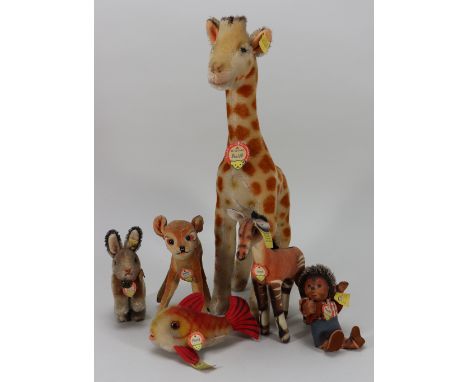 Six post-war Steiff animals, including Giraffe with button and tag, 14 ½” (37cm) tall, Okapi with button and tag, Bambi with 