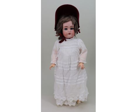 A Simon &amp; Halbig/K&amp;R bisque head doll, German circa 1910, with weighted blue glass eyes, open mouth, upper teeth and 