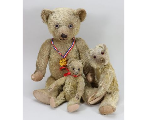 An early Chiltern blonde mohair Teddy bear, 1920s, the straw and kapok filled bear with large glass eyes, clipped muzzle and 