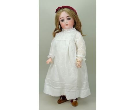 A Kammer &amp; Reinhardt/S&amp;H bisque head doll, German circa 1910, with weighted brown glass eyes, raised brows, open mout