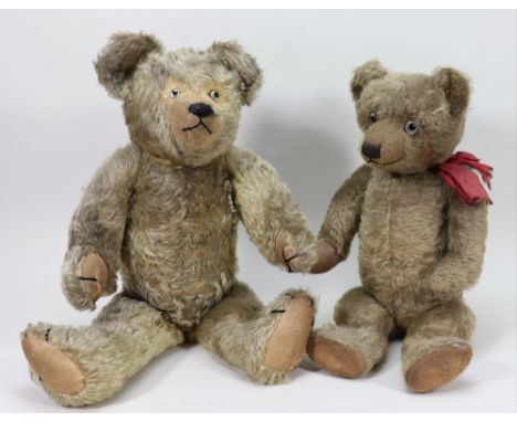 A pair of English 1920s Teddy bears, including a golden mohair Chiltern with glass eyes, clipped muzzle, with stitched nose a