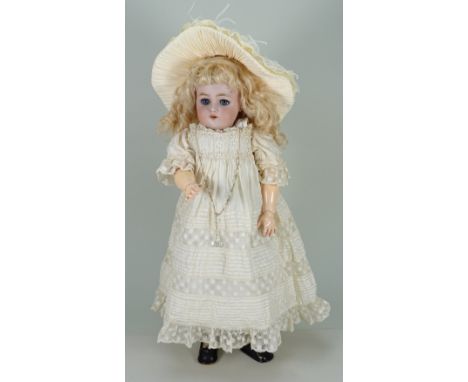 A charming Kammer &amp; Reinhardt/S&amp;H bisque head doll, German circa 1905, with weighted blue glass eyes with eyelashes, 