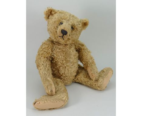 A good Steiff centre seam golden mohair Teddy bear, circa 1909, the straw filled bear with long golden mohair, boot button ey