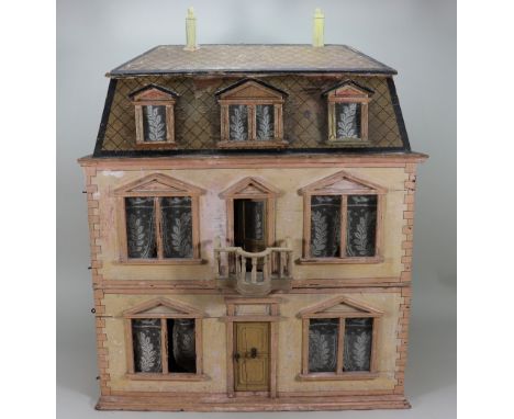 A Christian Hacker three storey dolls house, German circa 1900, the painted sandstone house with painted quoining, glazed win