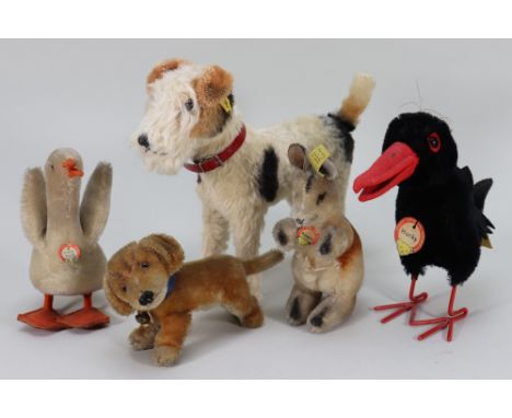 Five post-war Steiff animals, including Hucky the Raven with button and tag, 7 ½” (19cm) tall, Fox Terrier with button, Kango