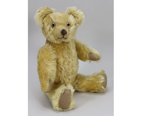 A charming golden mohair Teddy bear, English 1930s, kapok filled bears with glass eyes, clipped muzzle and brown stitched nos