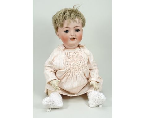 A K&amp;R/Simon &amp; Halbig mould 126 bisque head character baby doll, German circa 1920, with blue glass eyes and weighted 