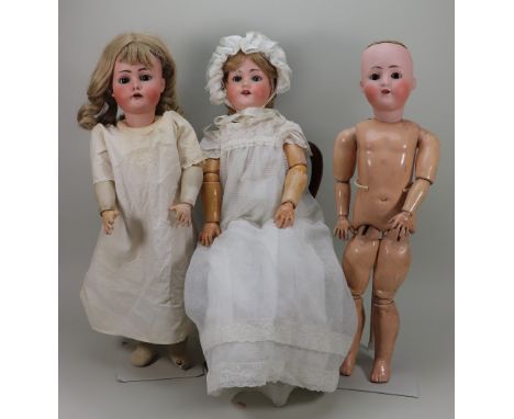 Three bisque head girl dolls, German circa 1910, including K*R, Simon &amp; Halbig mould 403, with fixed brown glass eyes, op