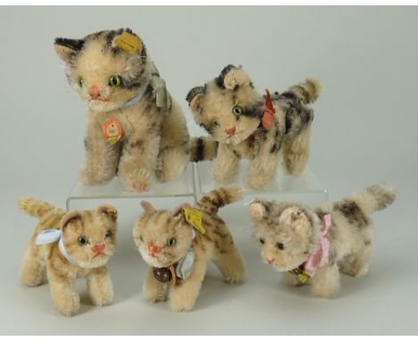 Five post-war Steiff mohair toy cats, seated Susi with swivel head with tag, button and label, 4 ¾” (12cm) tall, together wit