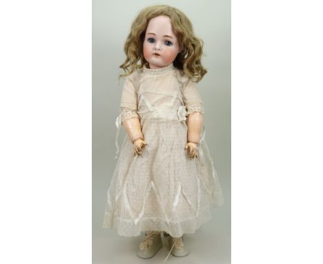 A Kammer &amp; Reinhardt/S&amp;H bisque head doll, German circa 1910, with weighted blue glass eyes, raised brows, open mouth