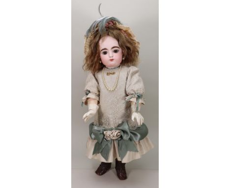 A Francois Gaultier size 9 bisque head Bebe doll, French circa 1890, the pale bisque head with fixed brown glass paper-weight