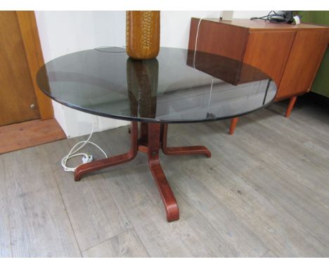 A Danish coffee table with bent ply base and smoked glass circular top. 90cm diameter x  50cm high 