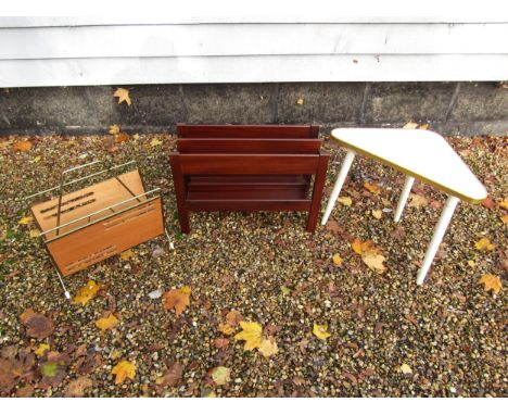 A Guy Rogers teak magazine rack together with a white melamine triangular table on tripod legs and a magazine rack with atomi