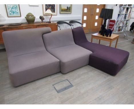 A Ligne Roset 'Confluences' three-section modular corner sofa suite in mauve and purple. With Fire label underneath. Measures