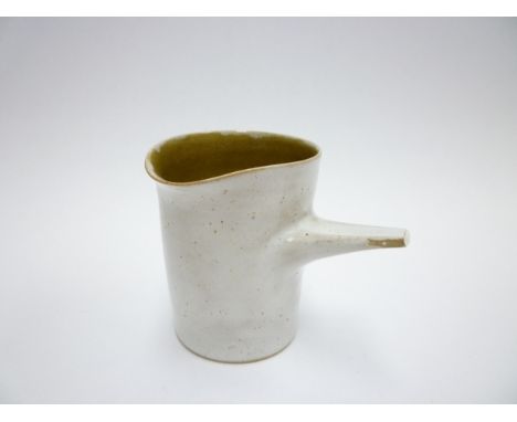 DAME LUCIE RIE (1902-1995) and HANS COPER (1920-1981) (ARR) A stoneware pourer in a pitted white glaze with ochre interior. S