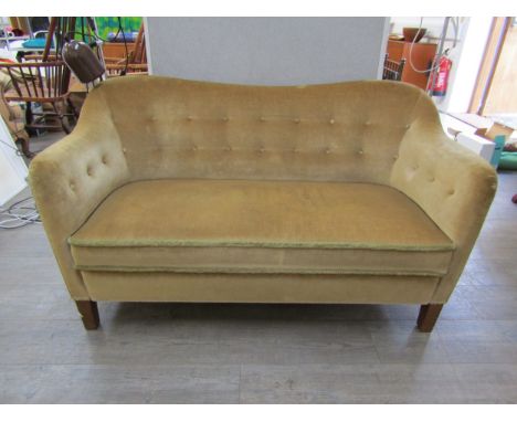 A 1940's Danish twin seater sofa with curved shaped back in original olive green upholstery.  137cm x  74cm x  80cm high 