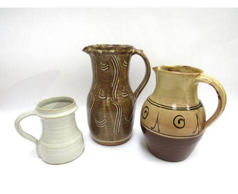 Winchcombe Pottery - A large early glazed earthenware jug (chips to glaze on the rim), together with a decorated stoneware ju